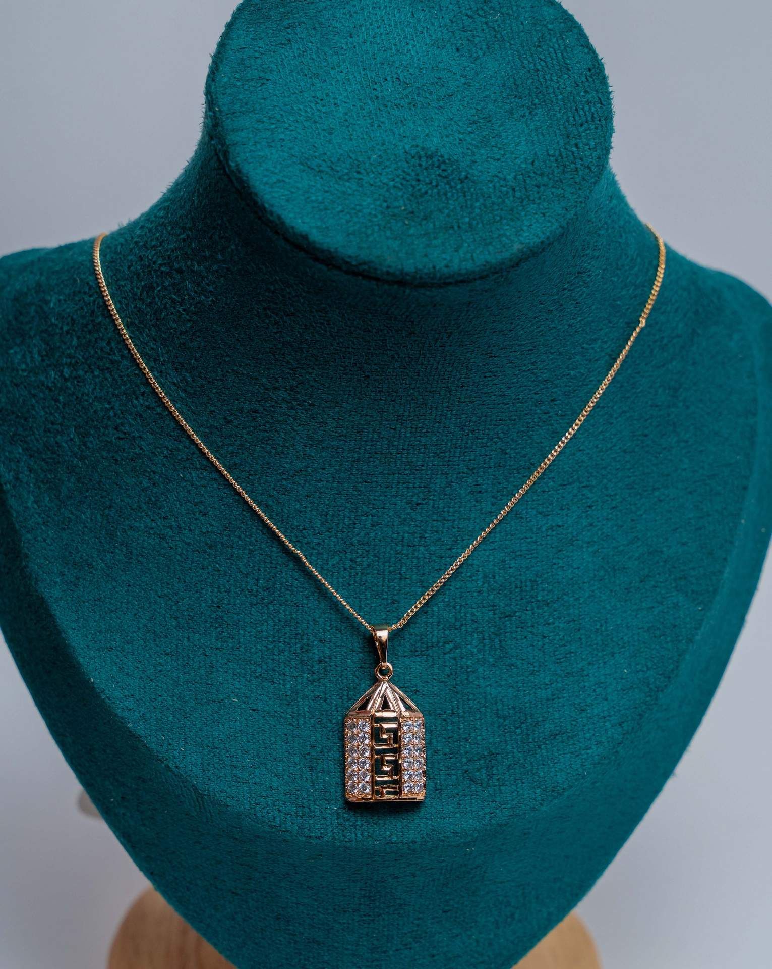 Gold-Tone House Pendant Necklace with Crystals