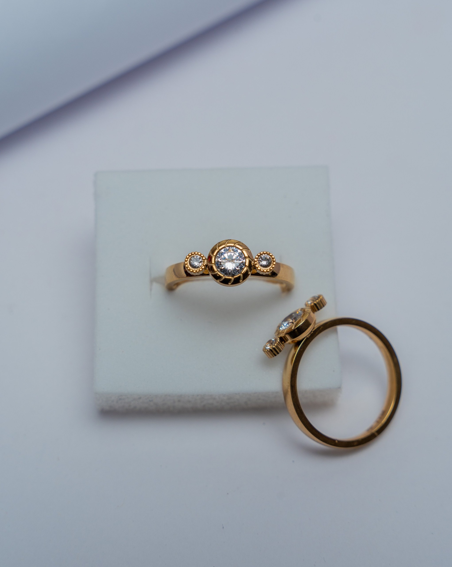 Gold Bezel Three-Stone Diamond Ring